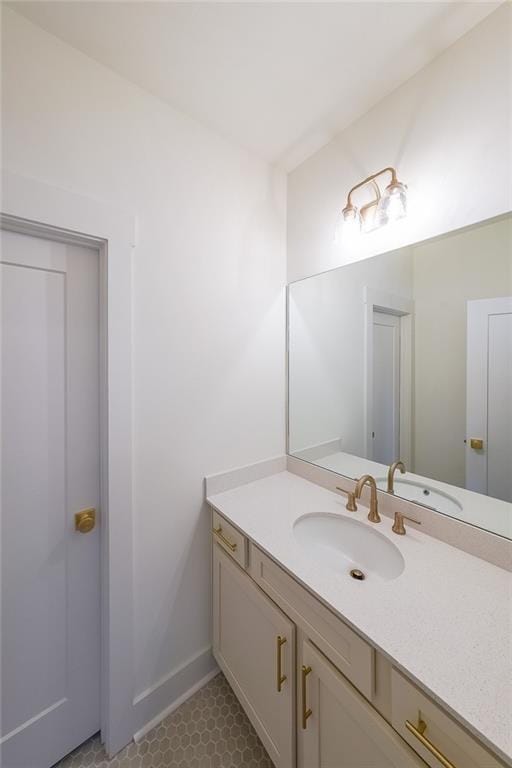 bathroom with tile patterned floors and vanity