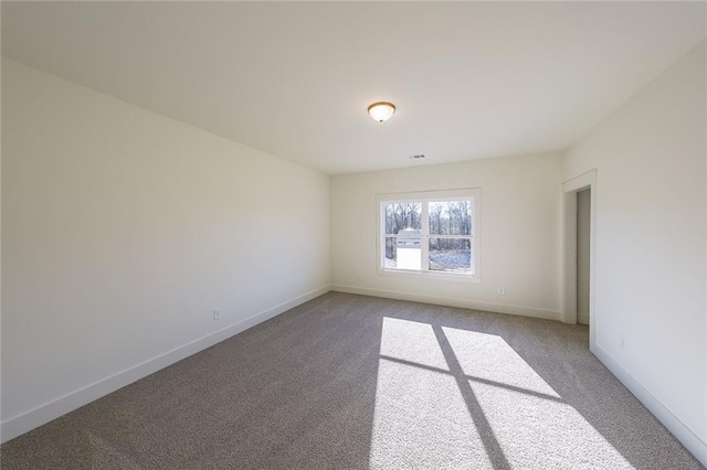 spare room with carpet floors