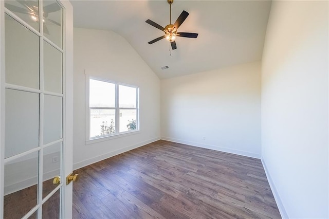 unfurnished room with ceiling fan, wood-type flooring, and vaulted ceiling