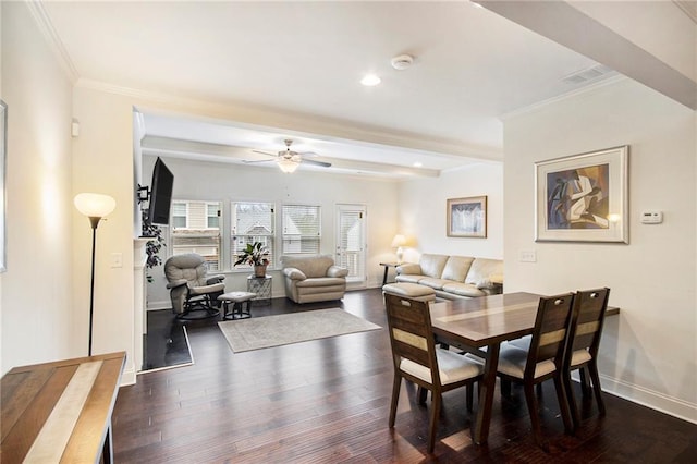 dining room featuring ornamental molding, dark wood-type flooring, and ceiling fan