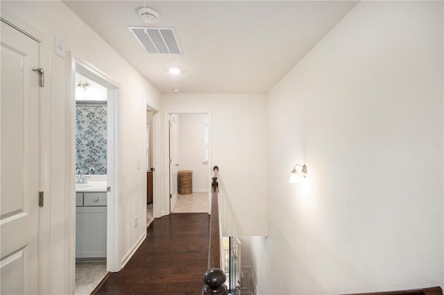 hallway featuring dark hardwood / wood-style floors