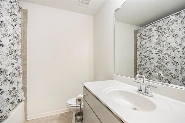 full bathroom featuring tile patterned flooring, vanity, toilet, and shower / bath combo with shower curtain