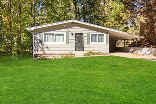 single story home with a front yard and a carport