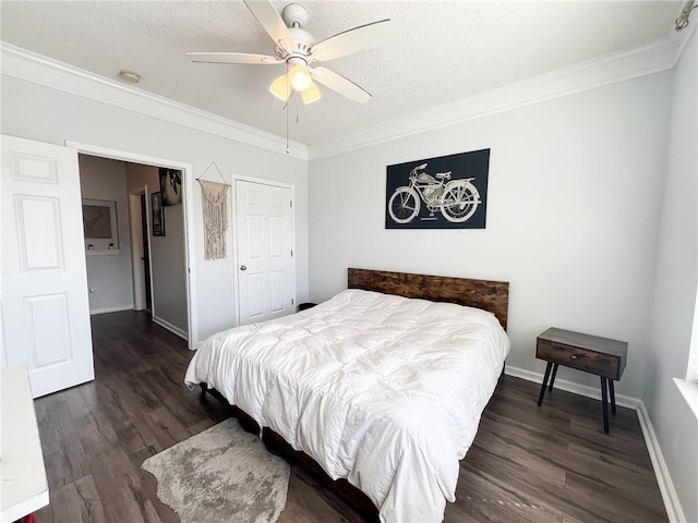 bedroom featuring ornamental molding, ceiling fan, and dark wood-type flooring