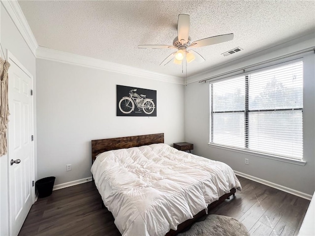 bedroom featuring crown molding, a textured ceiling, ceiling fan, and hardwood / wood-style floors