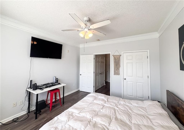 bedroom with a textured ceiling, dark hardwood / wood-style flooring, ornamental molding, and ceiling fan