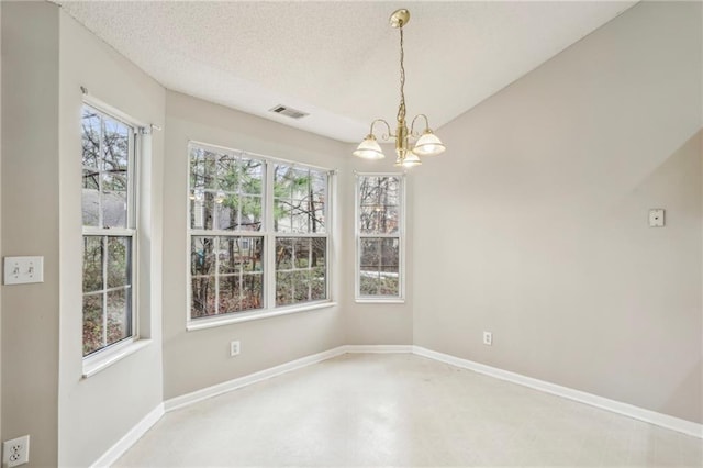 1559 Hillary Cove Ct, Lawrenceville, GA 30043 - empty room with a chandelier, a textured ceiling, and baseboards