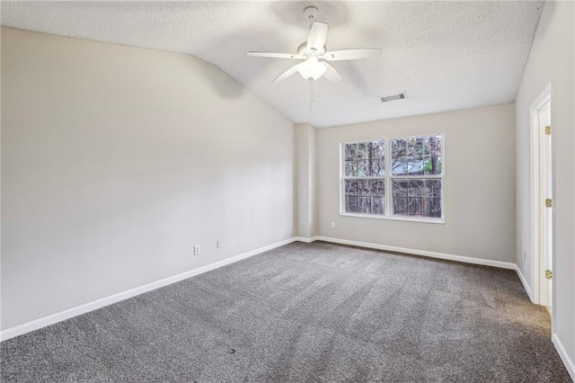 1559 Hillary Cove Ct, Lawrenceville, GA 30043 - carpeted spare room featuring vaulted ceiling, a textured ceiling, a ceiling fan, and baseboards