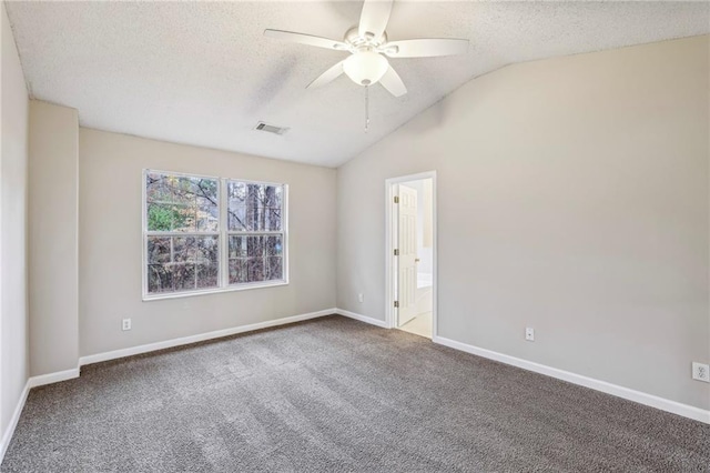 1559 Hillary Cove Ct, Lawrenceville, GA 30043 - spare room with a textured ceiling, ceiling fan, carpet floors, lofted ceiling, and baseboards