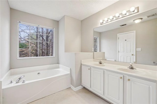 1559 Hillary Cove Ct, Lawrenceville, GA 30043 - bathroom featuring double vanity and a bath