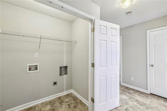 1559 Hillary Cove Ct, Lawrenceville, GA 30043 - laundry area featuring hookup for an electric dryer, washer hookup, baseboards, and a textured ceiling