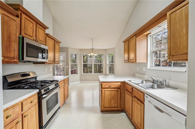 1559 Hillary Cove Ct, Lawrenceville, GA 30043 - kitchen with appliances with stainless steel finishes, a sink, a chandelier, light floors, and plenty of natural light