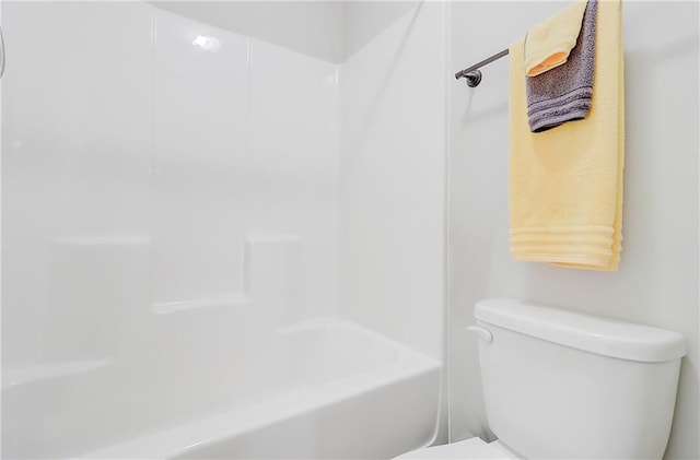 full bath featuring toilet, a bathing tub, and a shower