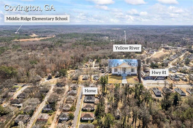 aerial view featuring a view of trees