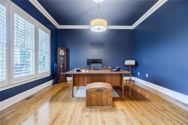 office with light wood-type flooring and crown molding