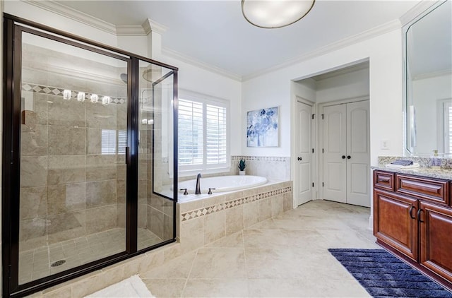 bathroom with tile patterned floors, vanity, separate shower and tub, and ornamental molding