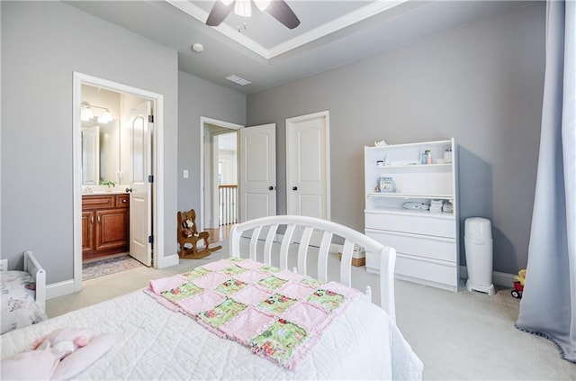 carpeted bedroom with connected bathroom and ceiling fan