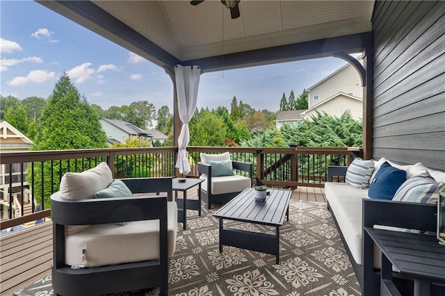 wooden terrace with outdoor lounge area and ceiling fan