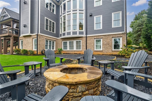 view of patio with a fire pit