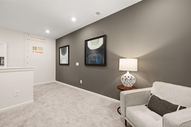 sitting room with light colored carpet