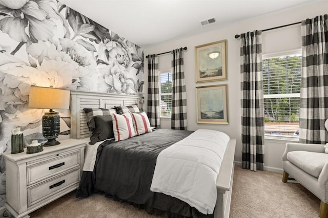 bedroom with light colored carpet