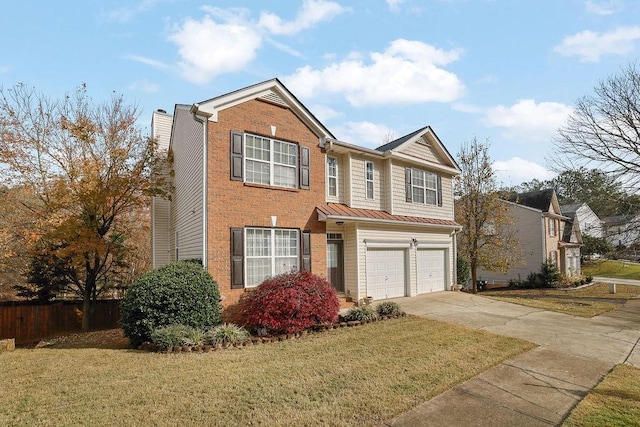 view of front facade with a garage and a front yard