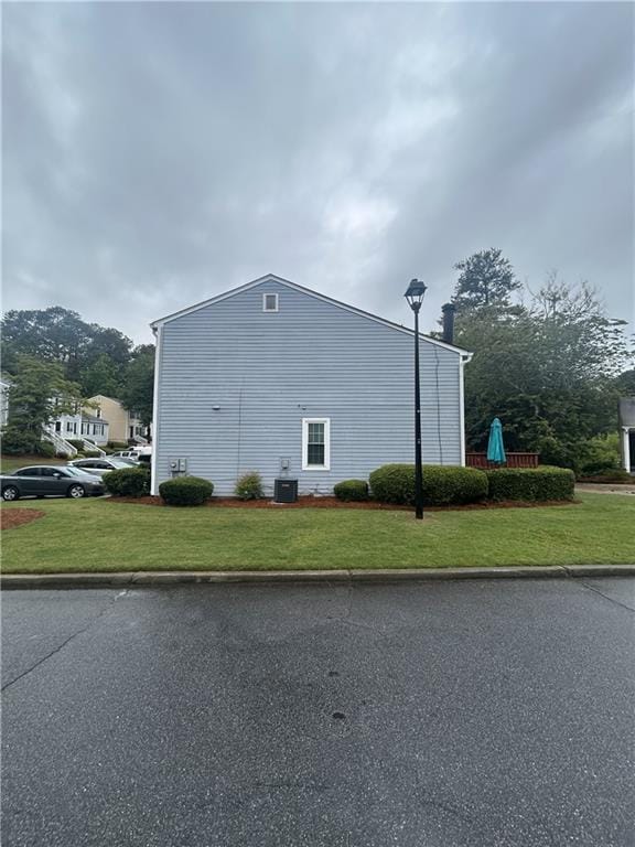 3414 Bayshore Dr, Atlanta, GA 30340 - view of side of property featuring a lawn and cooling unit