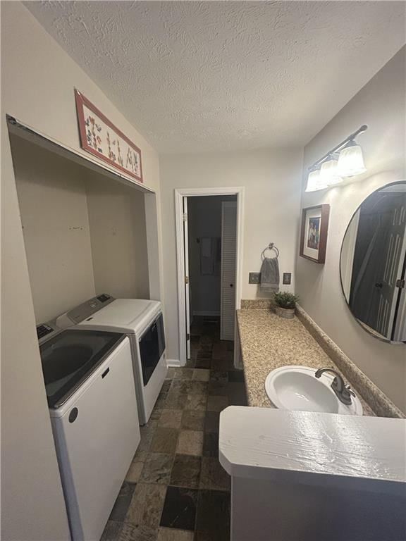 3414 Bayshore Dr, Atlanta, GA 30340 - washroom featuring separate washer and dryer and a textured ceiling