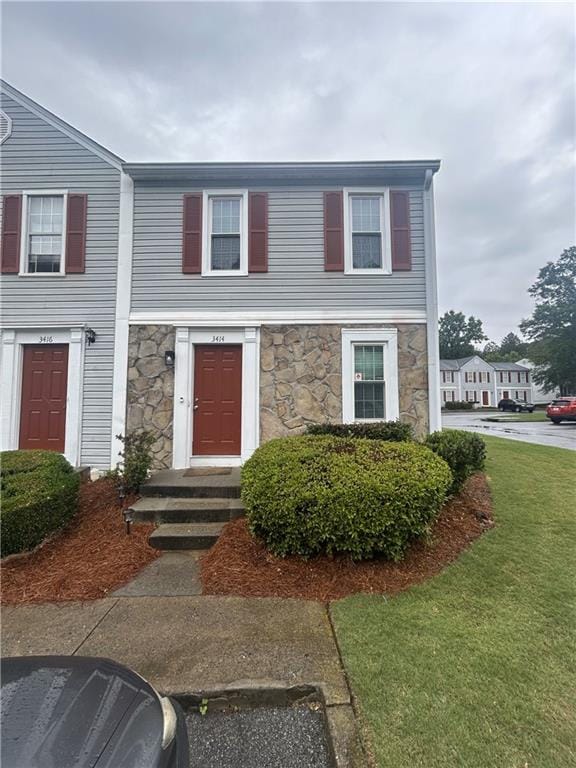 3414 Bayshore Dr, Atlanta, GA 30340 - multi unit property featuring stone siding and a front yard