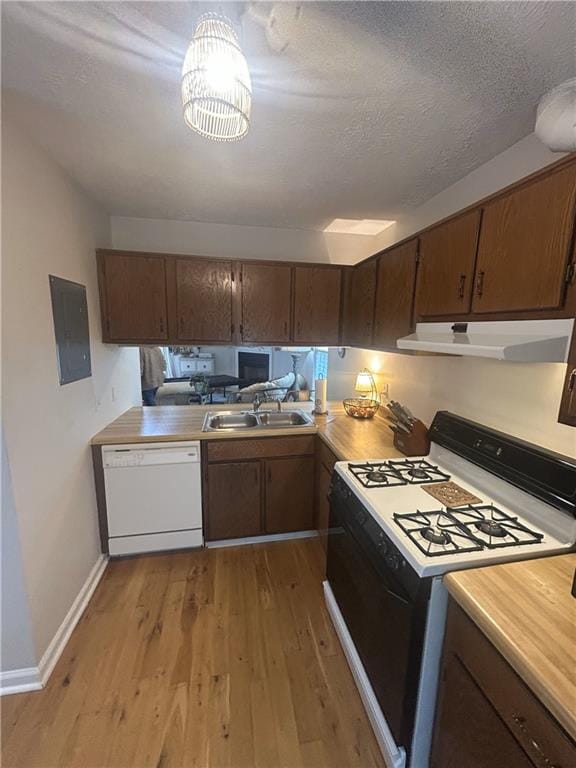 3414 Bayshore Dr, Atlanta, GA 30340 - kitchen featuring gas stove, white dishwasher, a sink, under cabinet range hood, and electric panel