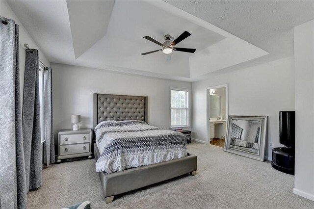 5385 Spotted Fawn Ct, Suwanee, GA 30024 - bedroom featuring a raised ceiling, carpet flooring, ceiling fan, and ensuite bathroom
