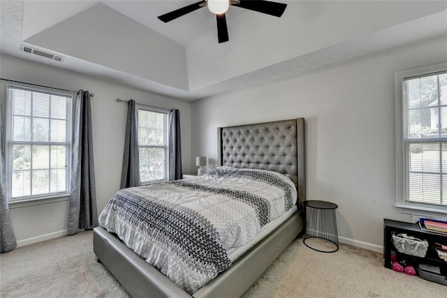 5385 Spotted Fawn Ct, Suwanee, GA 30024 - carpeted bedroom with multiple windows, ceiling fan, and a raised ceiling