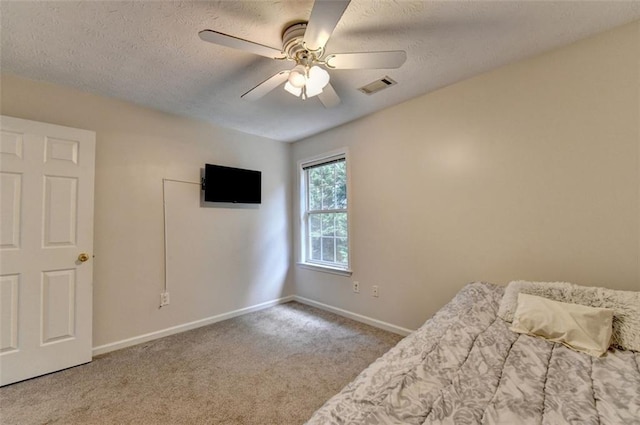 5385 Spotted Fawn Ct, Suwanee, GA 30024 - bedroom featuring a textured ceiling, carpet floors, and ceiling fan