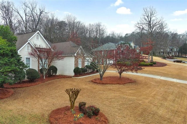 view of front of house featuring a front yard and stucco siding