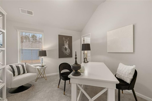 bedroom featuring lofted ceiling and carpet