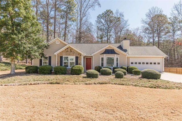 ranch-style home featuring concrete driveway, an attached garage, stone siding, and a chimney