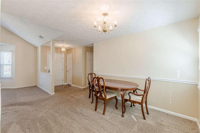 dining area with baseboards, visible vents, carpet floors, a textured ceiling, and a chandelier