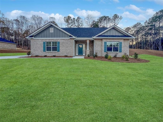 single story home featuring a front lawn, board and batten siding, and brick siding