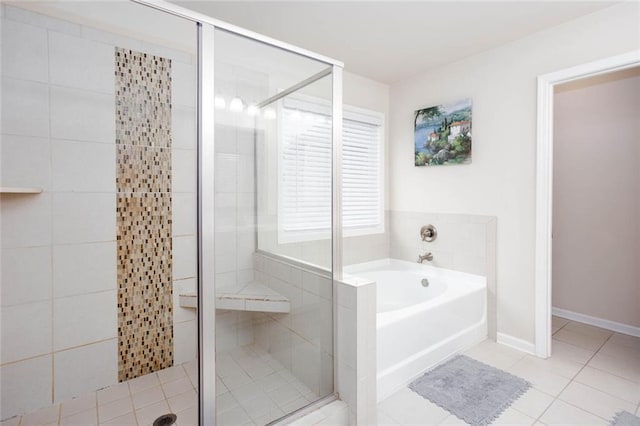 637 Little Bear Loop, Canton, GA 30114 - bathroom with a garden tub, a stall shower, and tile patterned flooring