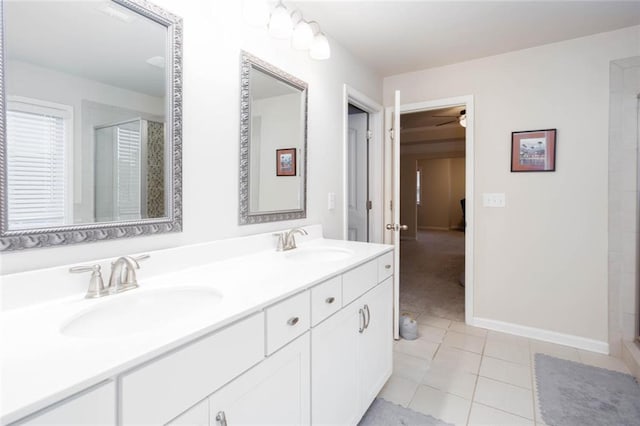 637 Little Bear Loop, Canton, GA 30114 - full bathroom featuring a shower stall, double vanity, tile patterned floors, a ceiling fan, and baseboards