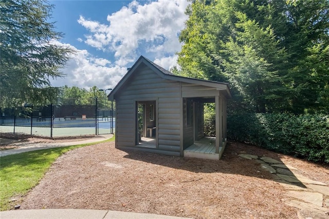 637 Little Bear Loop, Canton, GA 30114 - back of property featuring an outbuilding and a tennis court