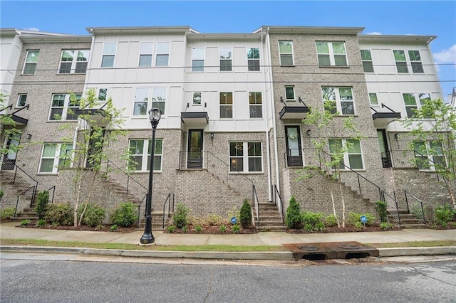 view of front of home featuring stairs
