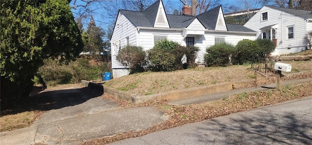 view of front of home with a chimney