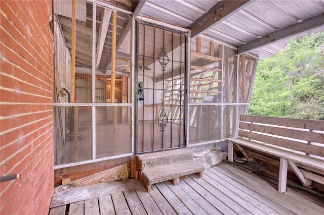 wooden deck featuring a sunroom