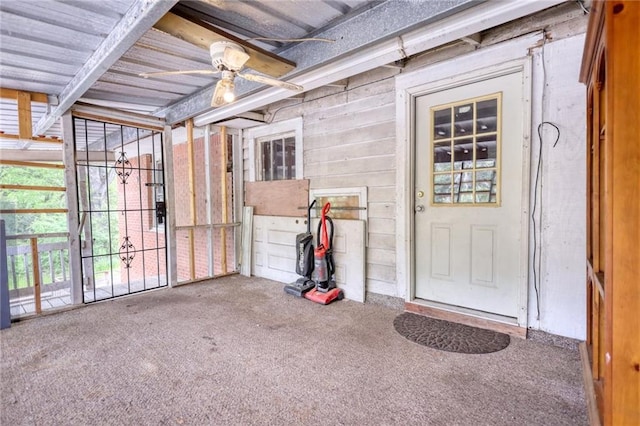 entrance to property featuring ceiling fan