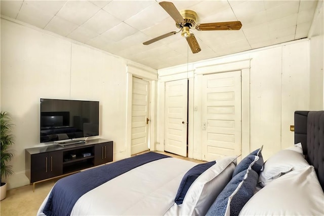 carpeted bedroom with ceiling fan