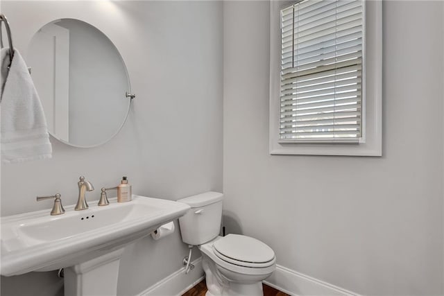 3108 Huntington Pl, Milton, GA 30004 - bathroom featuring toilet, baseboards, and a sink
