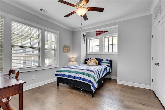 3108 Huntington Pl, Milton, GA 30004 - bedroom featuring wood finished floors, baseboards, crown molding, and a ceiling fan