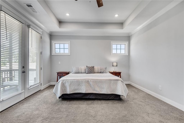 3108 Huntington Pl, Milton, GA 30004 - carpeted bedroom featuring access to exterior, a tray ceiling, multiple windows, and baseboards