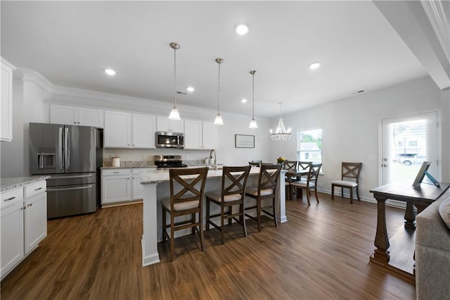 22 Mossy Oaks Ln NE, Rome, GA 30165 - kitchen featuring stainless steel appliances, a breakfast bar, white cabinets, ornamental molding, and recessed lighting